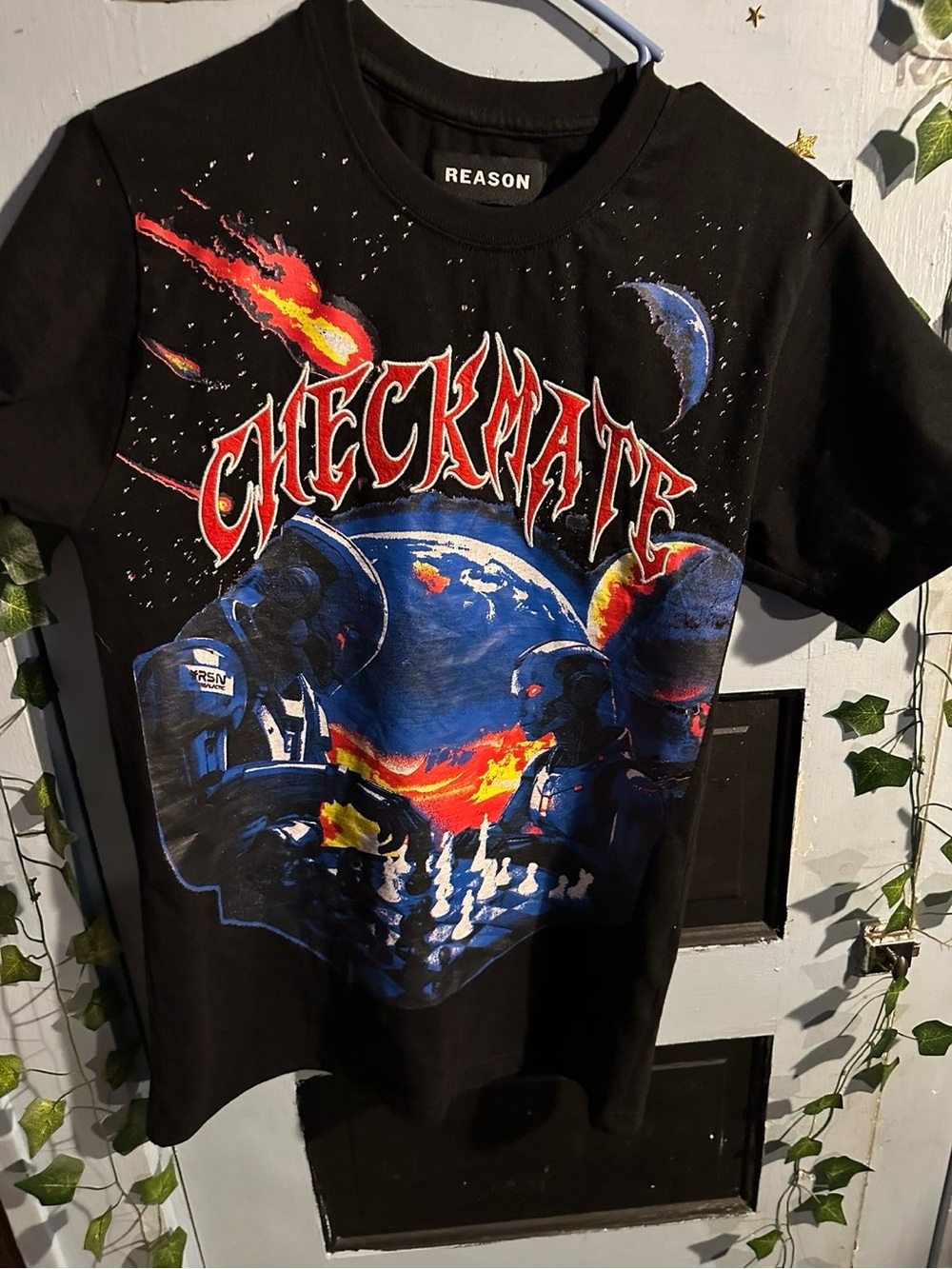 Reason Black Tee with Red & Blue 'Checkmate' Space Graphic